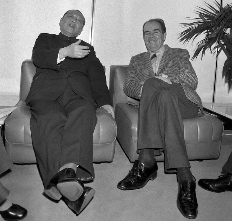 French Communist Party General Secretary George Marchais [right] speaks with Chinese Communist Party politician Xi Zhongxun in Paris, Dec. 2, 1983. (Philippe Wojazer/AFP)