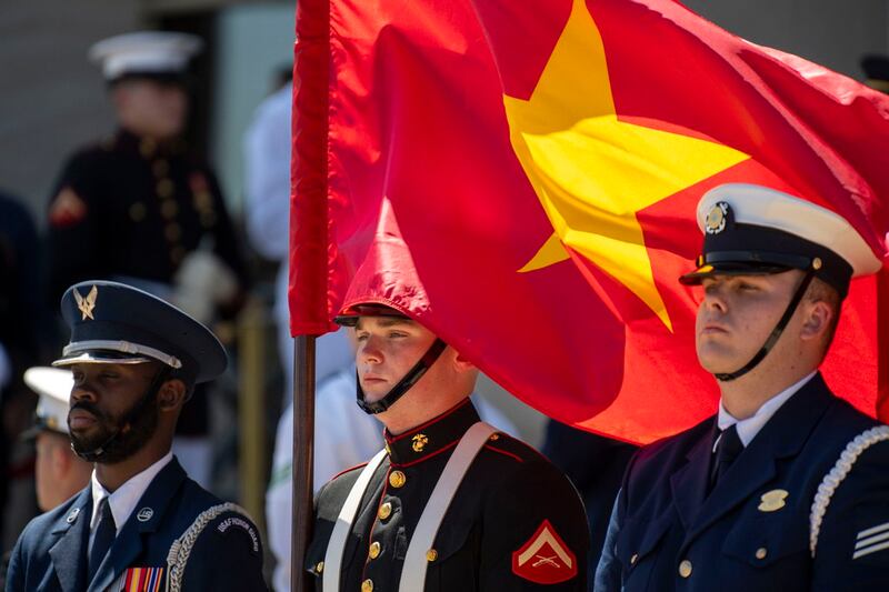 A U.S. Marine honor guard member holds the Vietnamese flag during an honor cordon welcoming Vietnamese Defense Minister Gen. Phan Van Giang to the Pentagon, Sept. 9, 2024. (Kevin Wolf/AP)
