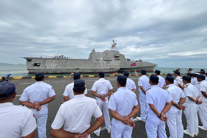 Royal Cambodian Navy personnel line up as the littoral combat ship USS Savannah docks in Cambodia's southern port city of Sihanoukville on December 16, 2024.  (Photo by Suy SE / AFP)