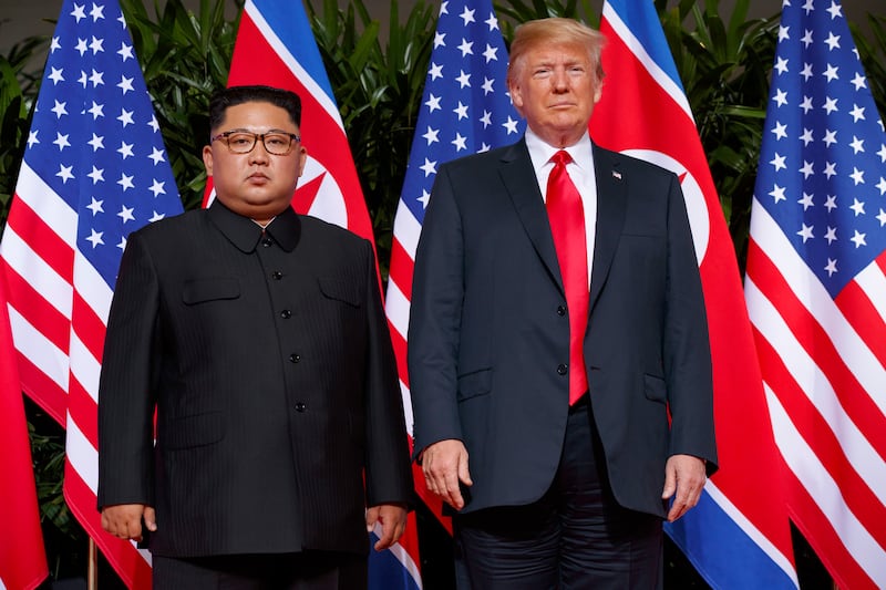 FILE - In this June. 12, 2018, file photo, U.S. President Donald Trump, right, meets with North Korean leader Kim Jong Un on Sentosa Island, in Singapore. North Korea says it will never unilaterally give up its nuclear weapons unless the United States removes its nuclear threat first. The statement carried by the official Korean Central News Agency on Thursday, Dec. 20, 2018, comes amid a deadlock in nuclear negotiations between the United States and North Korea. It raises further doubts on whether leader Kim Jong Un will ever relinquish an arsenal he may see as his greatest guarantee of survival. (AP Photo/Evan Vucci, File)